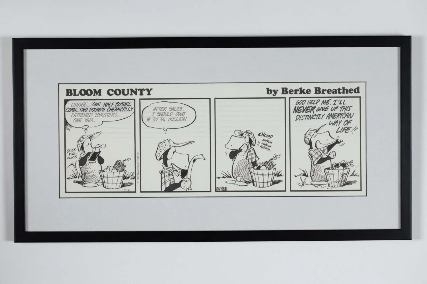 A framed Bloom County comic strip by Berkeley Breathed.