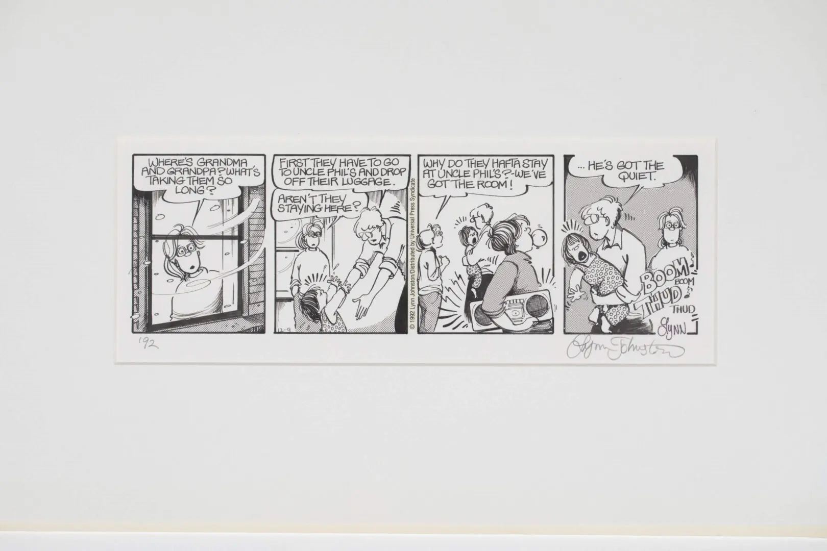 Comic strip showing a man trying to hang a picture frame while a woman watches.